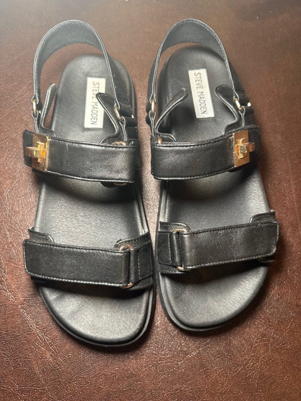 Steve Madden MONA black leather sandals featuring gold-tone hardware. Sz 9.5